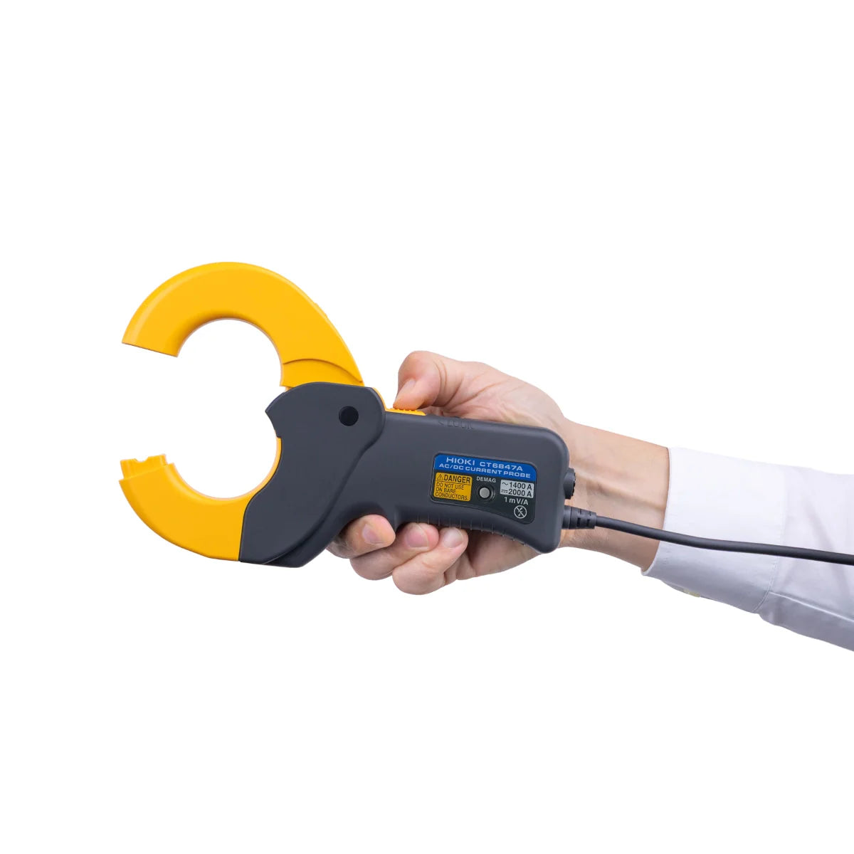 Hand holding a clamp meter with yellow and black design on a white background Hioki CT6847A AC/DC Current Probe